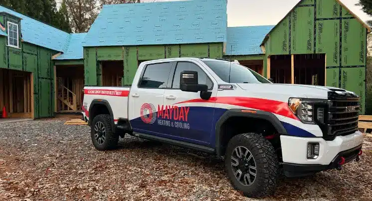 Technician diagnosing furnace failure in Hall County home during cold morning